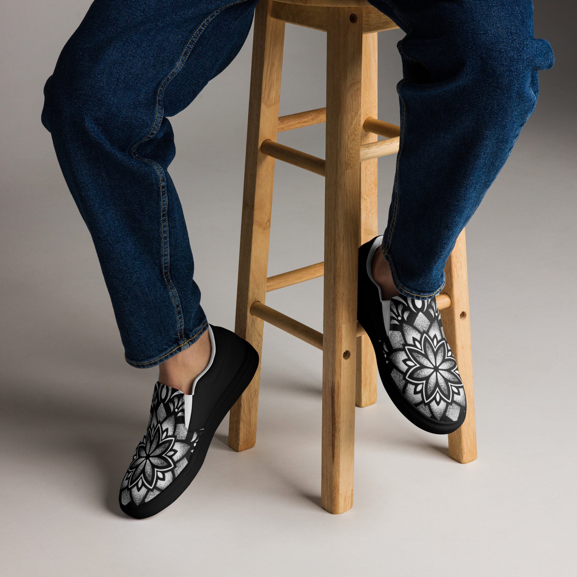 Man wearing mandala tattoo art slip on canvas shoes with jeans casual outfit
